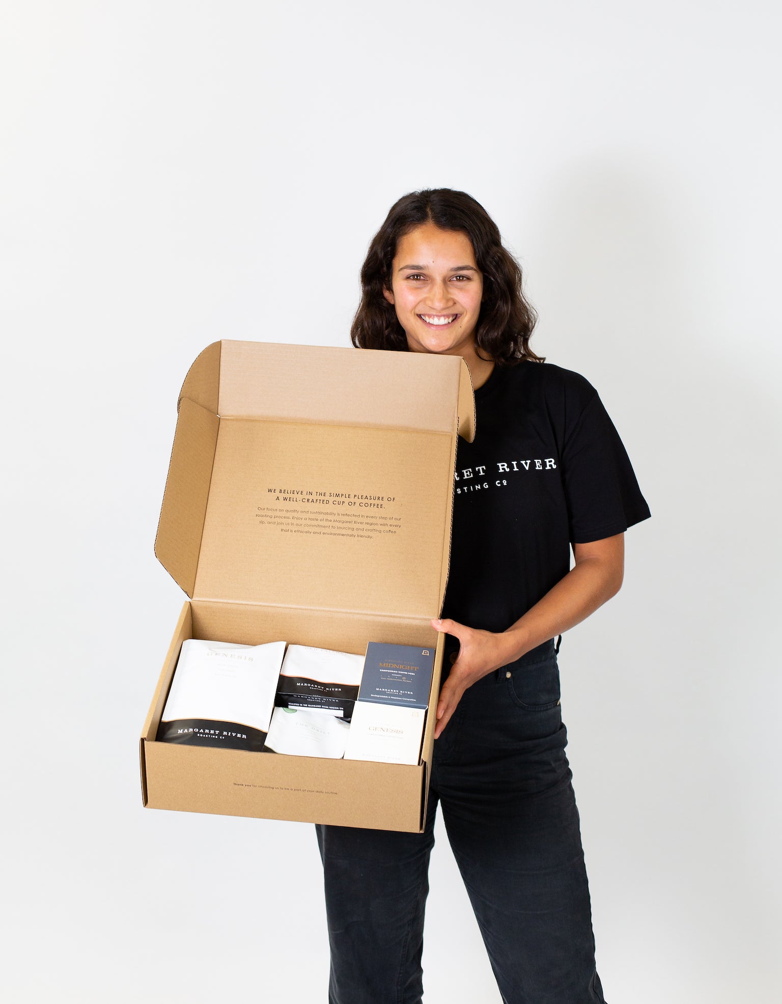 women holding a subscription box for Margaret River Coffee Roasting Co. coffee